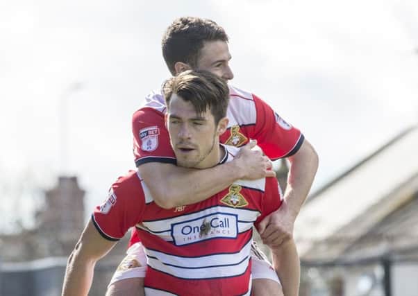 John Marquis celebrates scoring at Grimsby with Tommy Rowe