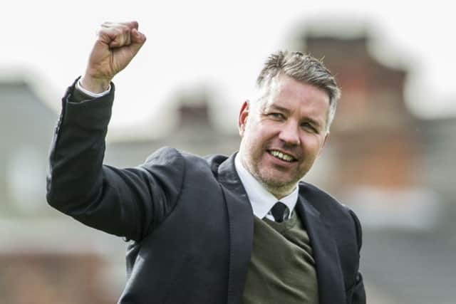 Darren Ferguson salutes the Rovers fans at Grimsby