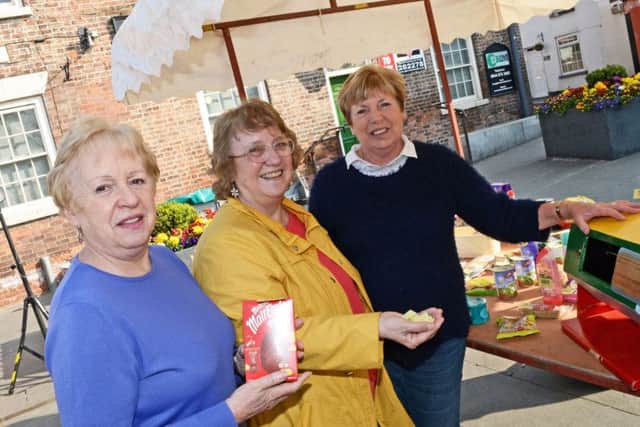 Gill Thompson, Hazel Wilson and Jenny Davey, pictured on the Tombola Stall. Picture: Marie Caley NEPB Easter MC 2