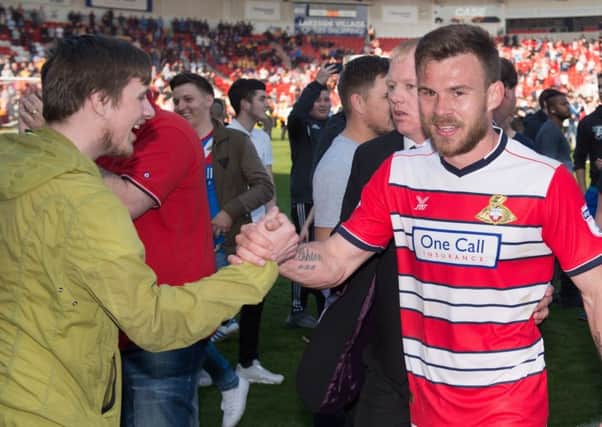 Andy Butler celebrates promotion with fans