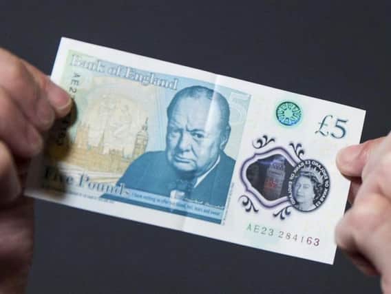 The plastic fiver, which replaced the old paper notes last September