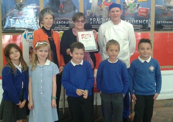 Caron Longdon from the Soil Association, Doncaster Council schools catering manager Kirk Sandall Infants School chef Guillaime Jayet-Laraffe and the school's pupils
