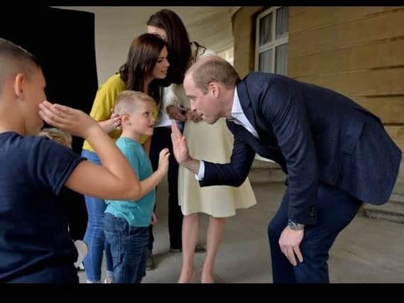 Prince William shares a high-five with Jamie