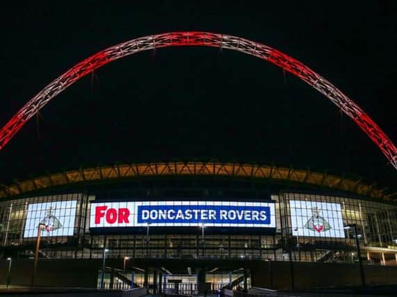 Wembley lit up in the colours of Doncaster Rovers.