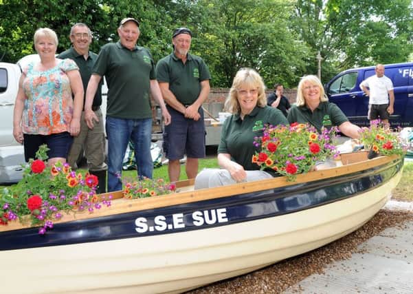 Eastoft Gardening Club are using a boat as a flower planter on High Street, Eastoft.