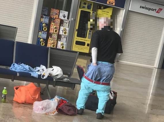 Louis Tomlinson's Instagram picture of a man dropping his trousers at Doncaster Airport. (Photo: Louis Tomlinson/Instagram)