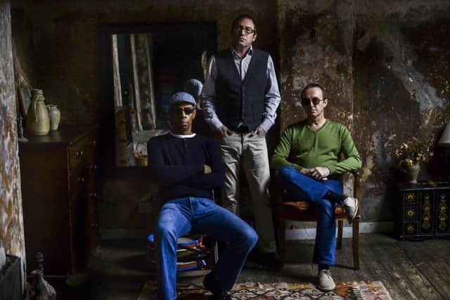 From left, drummer Oscar Harrison, singer Simon Fowler and guitarist Steve Cradock of Ocean Colour Scene.