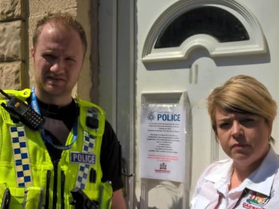 Sergeant John Crawford with Nicola Dagnall, of Barnsley Council's enforcement team, at the property that was closed down.