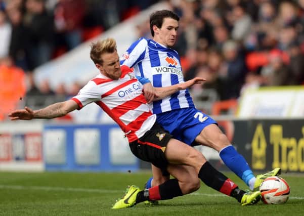 James Coppinger goes up against Kieran Lee
