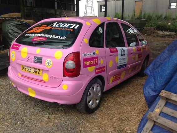Mick Fletcher and his team's banger which they will drive to Benidorm to raise money for Ashgate Hospicecare