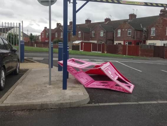 The pink playhouse blocks the entrance to the car park at Bentley railway station after being lifted up by high winds.