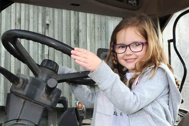 Amelia Bramley inside a tractor