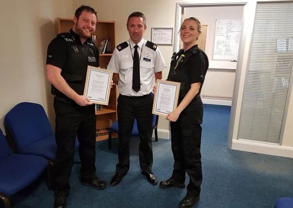 PC Terry Davidson and Doncaster Council neighbourhood response officer Claire Scott receive their award from Superintendent Neil Thomas.