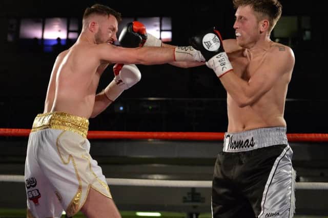 Richard Thomas and Daniel Slaney exchange punches in their Central Area title clash. Picture: Dean Woolley