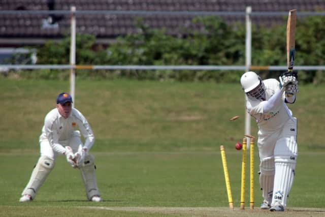 Another Knottingley batsman is clean bowled, as Brodsworth wicketkeeper Ross Weston looks on.
