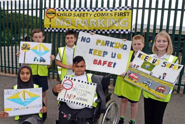 Year six children at Lakeside primary school pictured campaigning against people parking outside their school, taking a stand to promote the safety of the children. Picture: Marie Caley NDFP Parking Protest MC 2