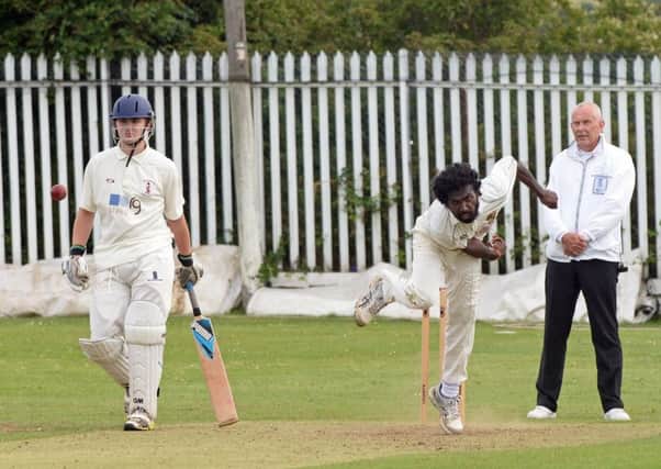 Nisala Gamage bowls for Conisbrough as Doncaster Town batsman Sunny Day-Tennent watches on. Picture: Marie Caley NDFP Conisbrough v Donc Town MC 6