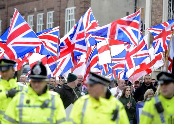 The Britain First Party stage a march through the streets of Rotherham. Police escort and guide the march