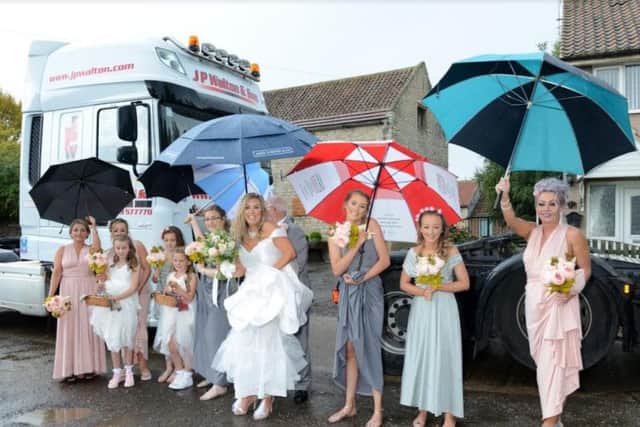 The wedding party with the lorries.