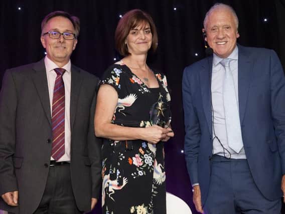 Doncaster and Bassetlaw Teaching Hospitals most caring person winner Jo Mann with Jim Brimble of NHS Professionals and TV personality  Harry Gration