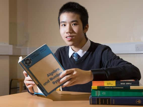 Wang Pok Lo has earned a first class maths degree - at the age of 13. (Photo: SWNS).