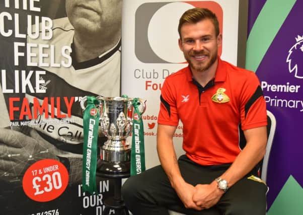 Doncaster Rovers club captain Andy Butler with the Carabao Cup. Picture: Phil Ryan