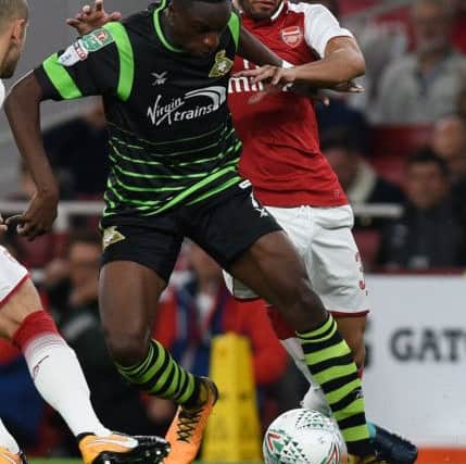 Rovers star man Rodney Kongolo battles with Arsenal's Mohamed Elneny