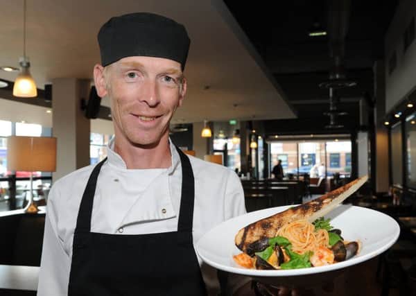 Head chef Nick Hinton at Relish with the seafood linguini dish.