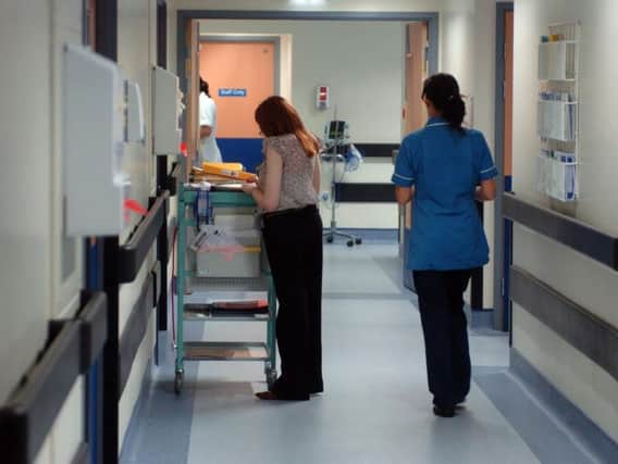 Hospital staff at work on the corridors
