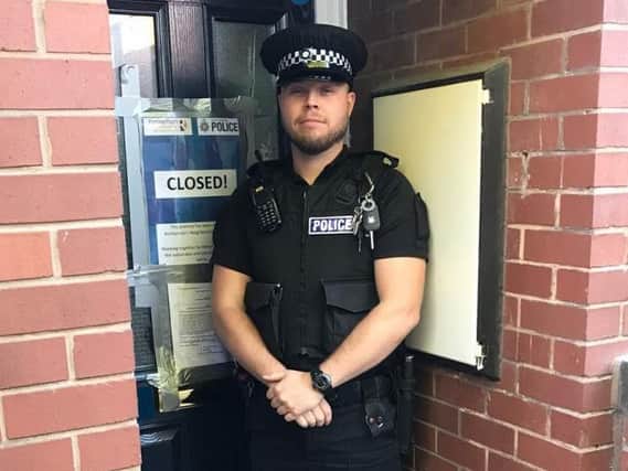 PC Lee Smith outside the Rotherham flat closed by police due to antisocial behaviour complaints