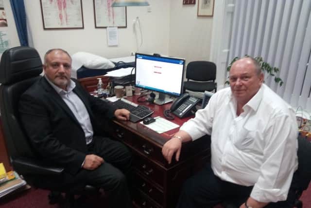 Dr Mohammed Khan of the Phoenix Practice, Doncaster, which could merge with the Flying Scotsman Centre, with patient participation group representative Ray Guffick
