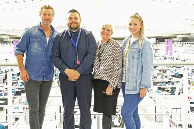 Footballl pundit Robbie Savage with Michael Januszkiewicz,  Chris Beresford, and Becca Taylor at the BT calls centre