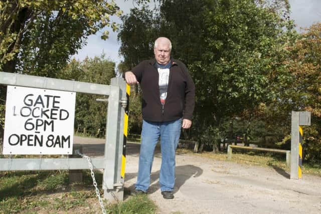 Coun Mick Glynn at the entrance to the park, and car park at St Mary's Road in Dunsville