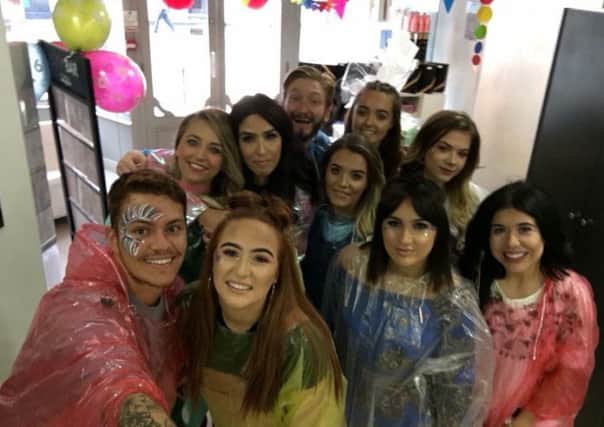 Staff at Saks Doncaster celebrate six years in business with a festival theme