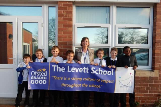 Headteacher Karen Green and children from Levett School