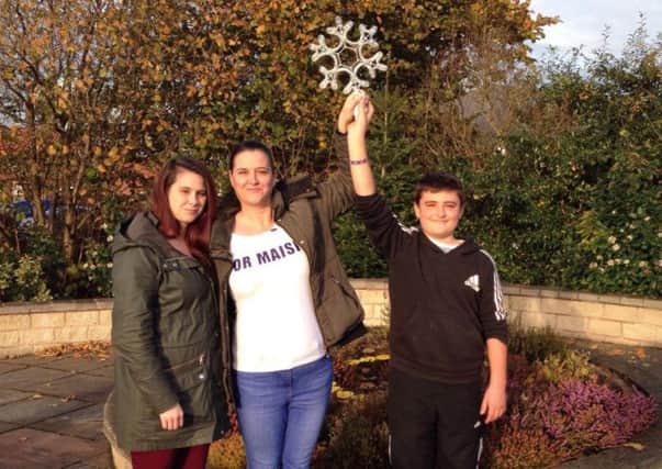Pictured with the star are (from left) sister Amy, mother Helen Cousin, with brother Oliver Cousin-Stirk