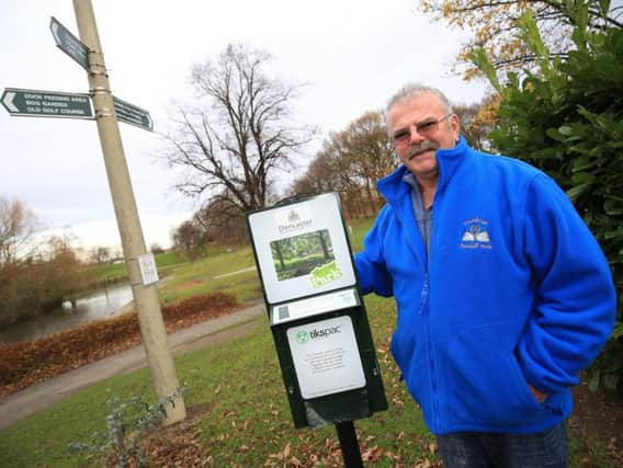 Don Crabtree with the new poo bag dispenser in Sandall Park, Doncaster.