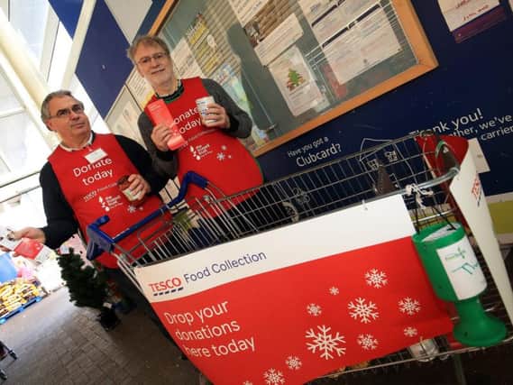 Doncaster Foodbank collection at Tesco Extra, Woodfield Plantation, Balby. Pictured are Rob James and Project manager Mark Snelson.