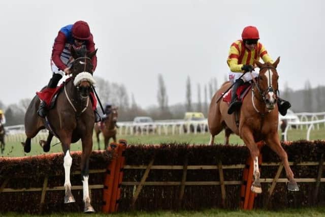 The favourite, Poetic Rhythm (right), pounces late on Mulcahy's Hill, to win the Grade One Betfred Challow Novices' Hurdle at Newbury on Saturday.