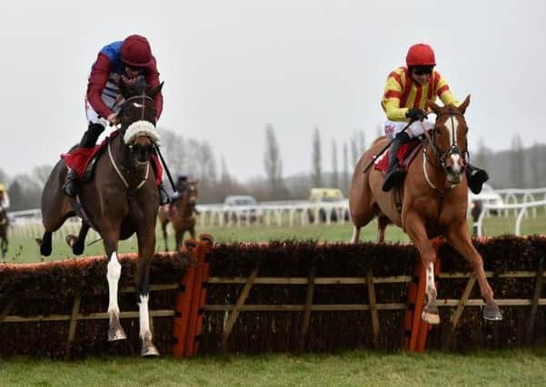 The favourite, Poetic Rhythm (right), pounces late on Mulcahy's Hill, to win the Grade One Betfred Challow Novices' Hurdle at Newbury on Saturday.