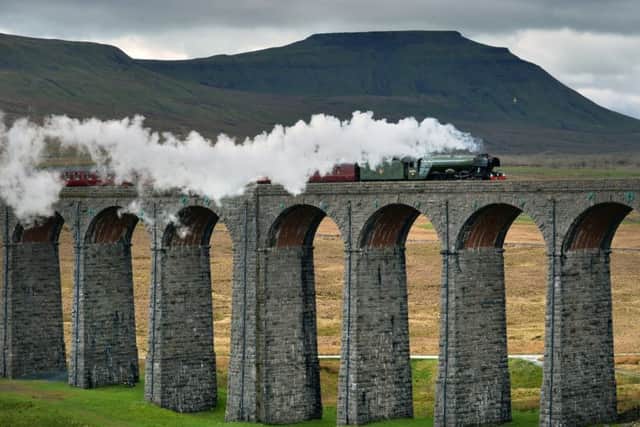 The Flying Scotsman crossing the Ribblehead Viaduct, on its  journey from Oxenhope to Carlisle to celebrate the re-opening of the Settle Carlisle Railway line.  31 March 2017.  Picture Bruce Rollinson