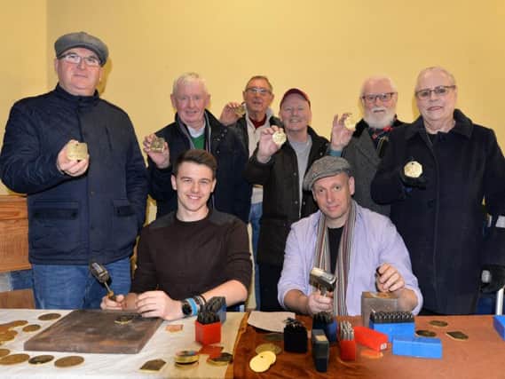 Sculptor Ian Randall (right), pictured with student sculptor Cameron Lings visited Armthorpe Coronation Club, to put names on checks that will be added to the memorial. They are pictured with l-r Steve Hardy, Coronation WMC president, Roy Gibson, club member, Allan Booth, Coronation WMC vice president, Dennis Nowell, member, David Fawden, former surface worker and his wife Maureen. Picture: Marie Caley NDFP Miners Sculptor MC 1