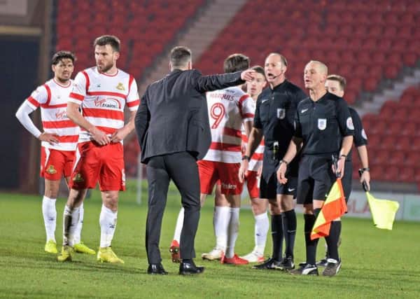 Darren Ferguson confronts referee Andy Haines after the game on Saturday
