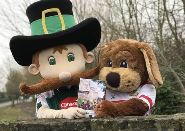 A new guide which showcases all that is good about the town has been launched with a football match. The event also saw the two sporting teams mascots, Donny Dog and Pilgrim take part in a pre kick off presentation of one of Doncasters other heros Paddington Bear, as well as the handover of the very first of the Visitor Guides.