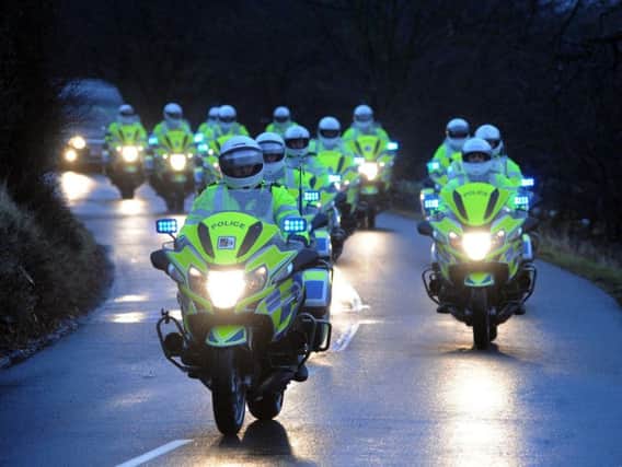 Police officers led the funeral cortege