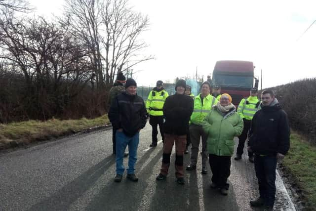 Protesters and police outside the test drilling site for fracking at Misson Springs, near Doncaster