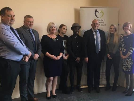 Government minister Nadhim Zahawi with staff and young people from Doncaster Children's Services Trust