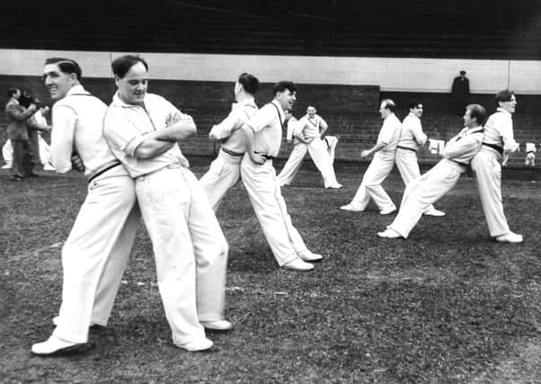 Leeds, Headingley, 1st April 1957

Don Wilson, skipper Billy Sutcliffe, Cowan, Close, Appleyard and Trueman, with other members of the Yorkshire County cricket team, get some physical training in before the start of practice at the nets at Headingley.