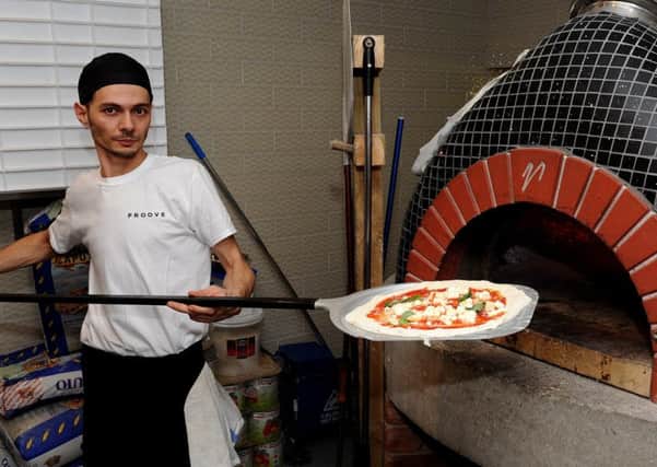 Head chef Michele Magnotta at Proove with a magherita pizza. Picture: Andrew Roe