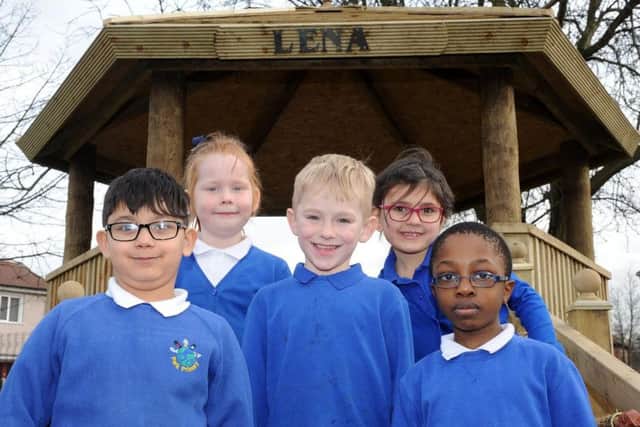Pupils of Park Primary School in the memorial garden for Lena Grabowska which has been damaged.